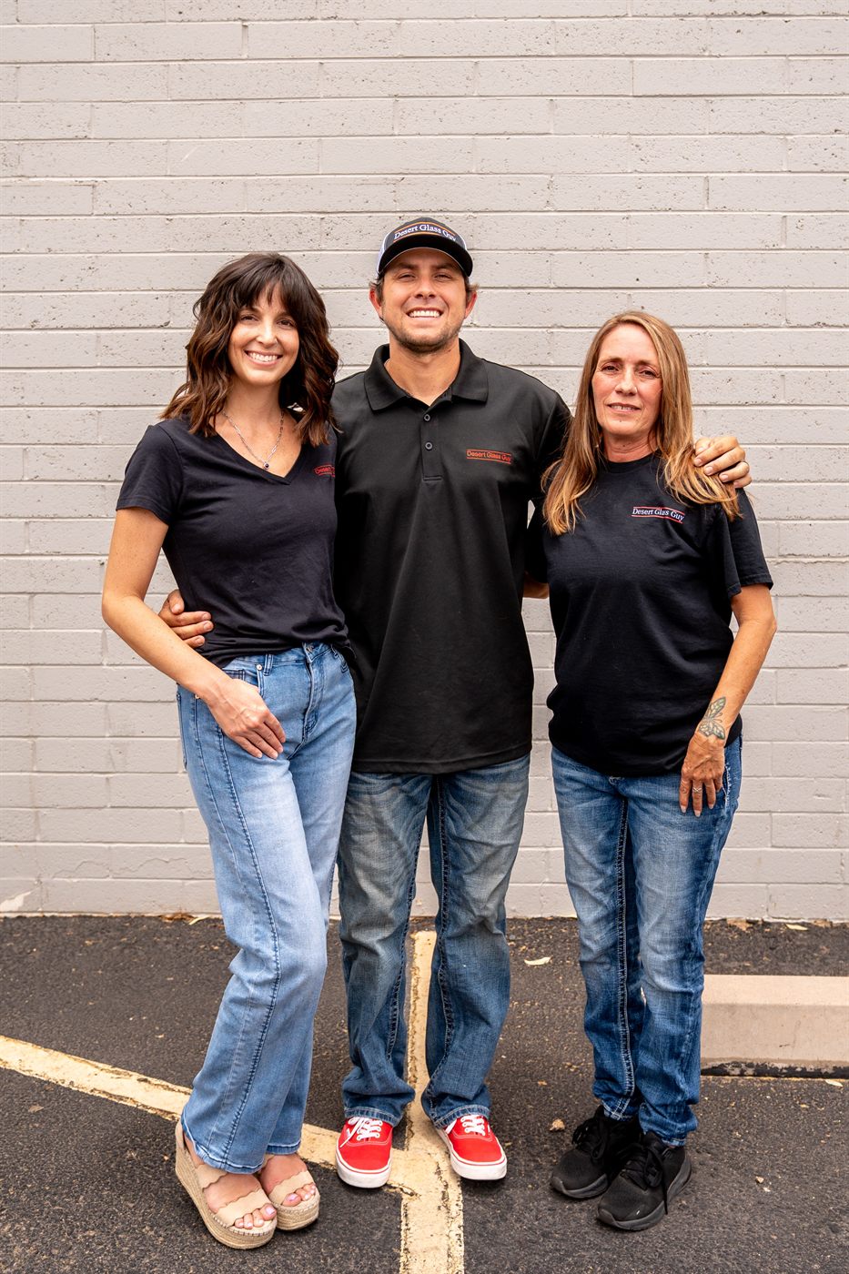 Marisa, Cody and Kim standing together outside the shop