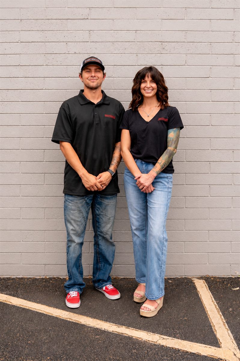 Cody and Marisa outside the shop