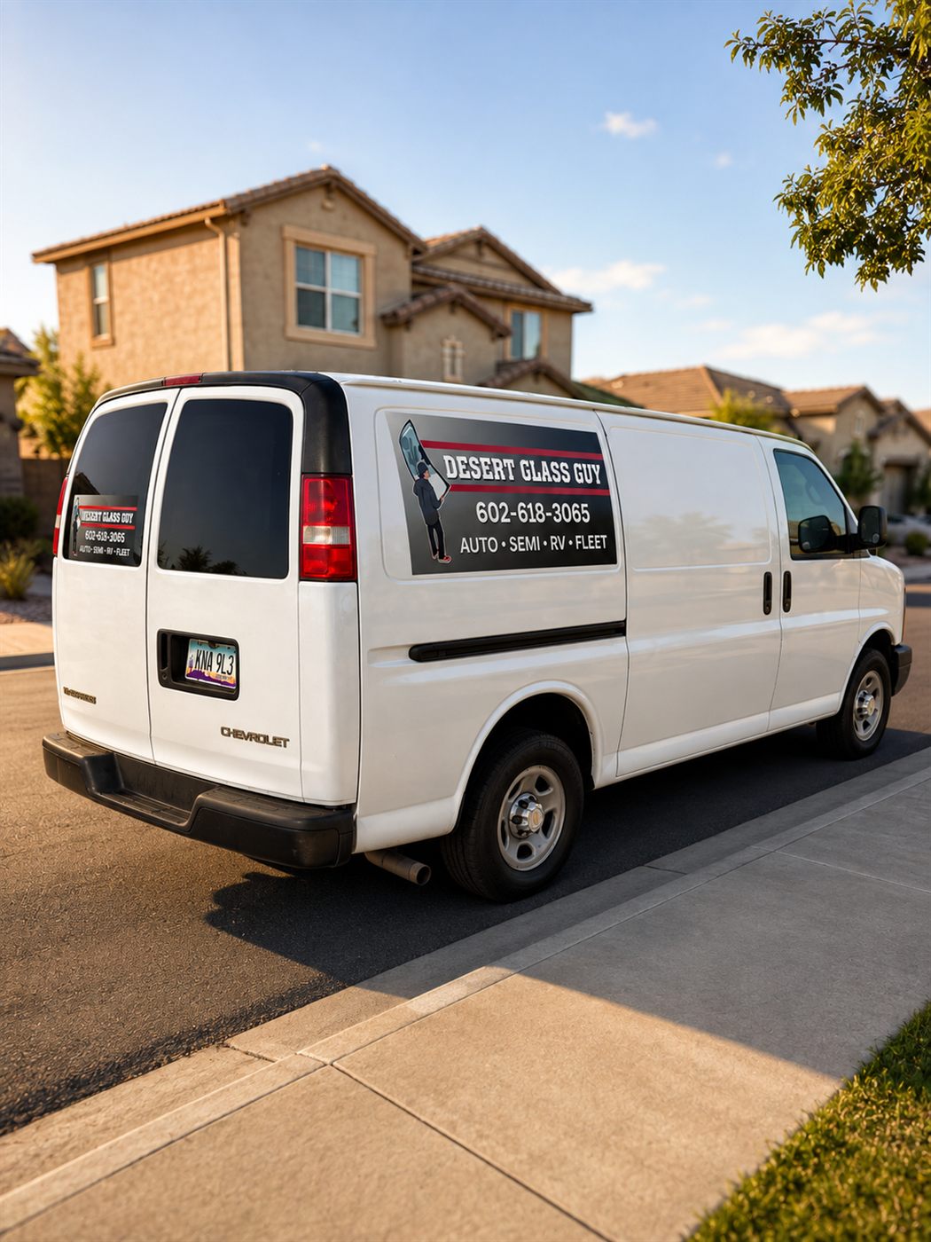 Desert Glass Guy van parked in a neighborhood for a mobile install